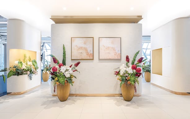 Floral arrangements and abstract art in Miracle Lounge, Bangkok Airport, Thailand.