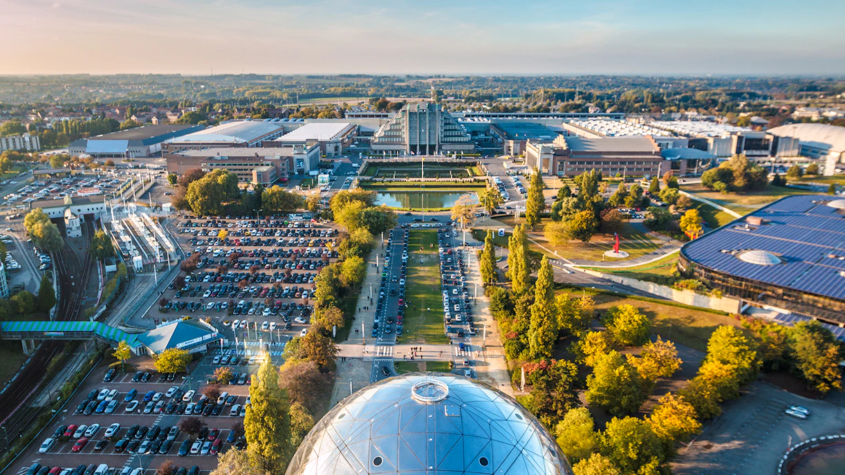 Aerial view of Brussels from Atomium, showcasing cityscape and surrounding greenery.