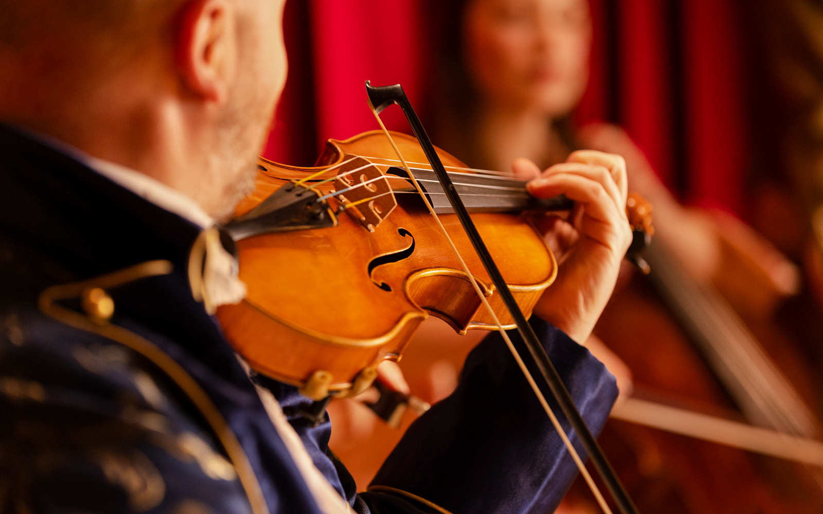 Violinist performing at Mozart Dinner Opera in Prague.