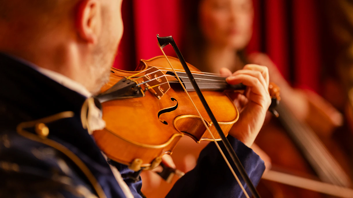 Violinist performing at Mozart Dinner Opera in Prague.