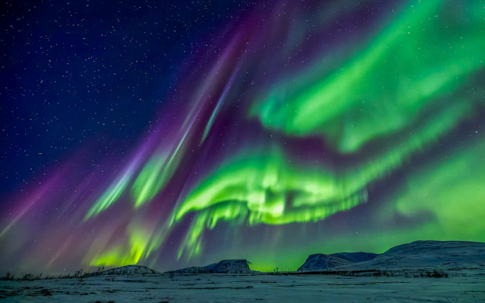Northern lights over Mount Nuolja in Abisko National Park, Sweden.