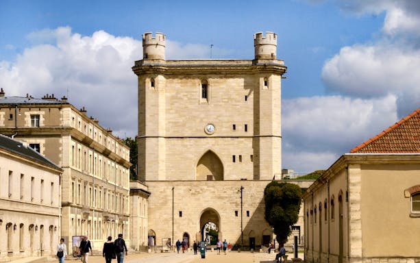 Château de Vincennes entrance with visitors walking nearby, Paris, France.