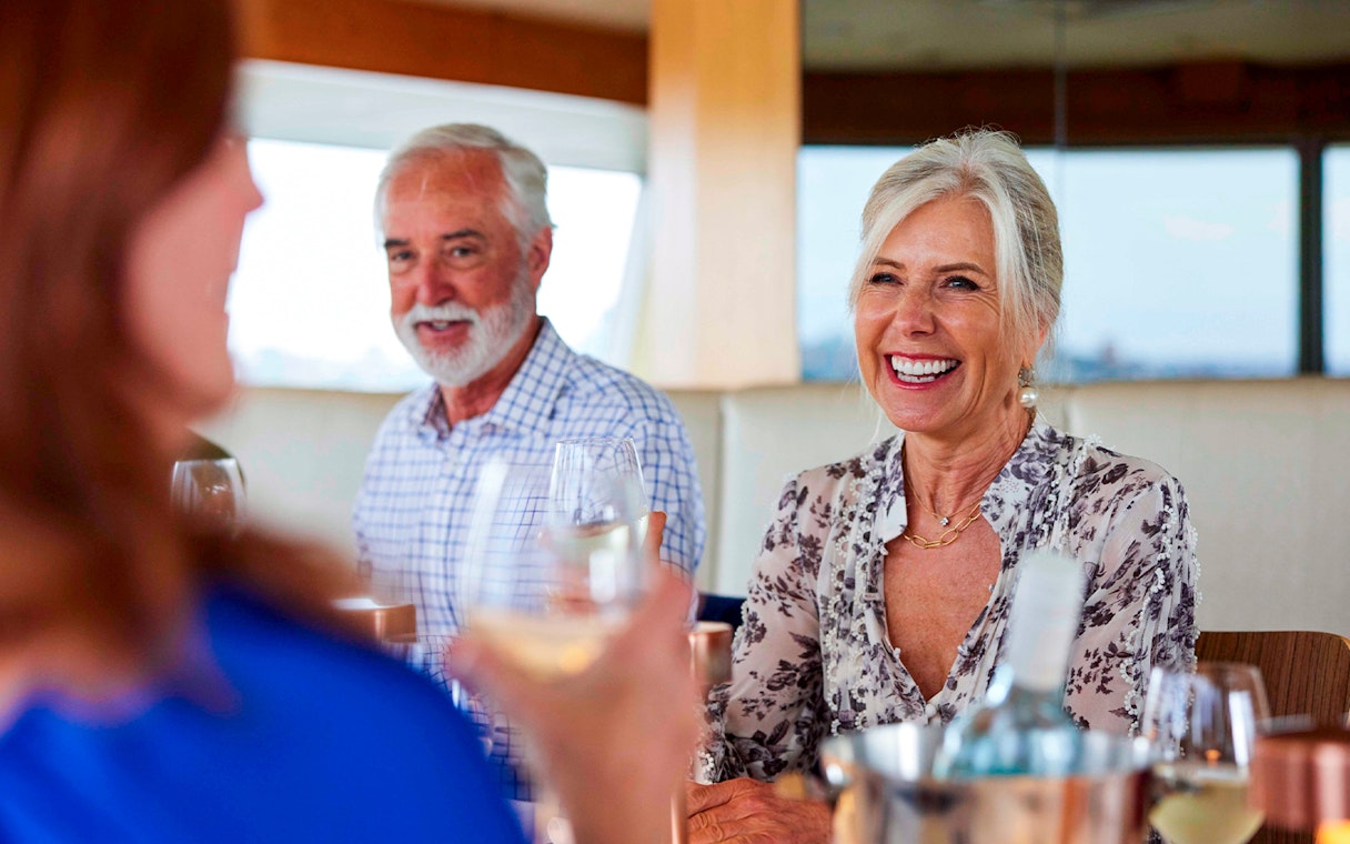 Guests enjoying a meal on the Sydney Harbour Top Deck 2 Course Dining Cruise.