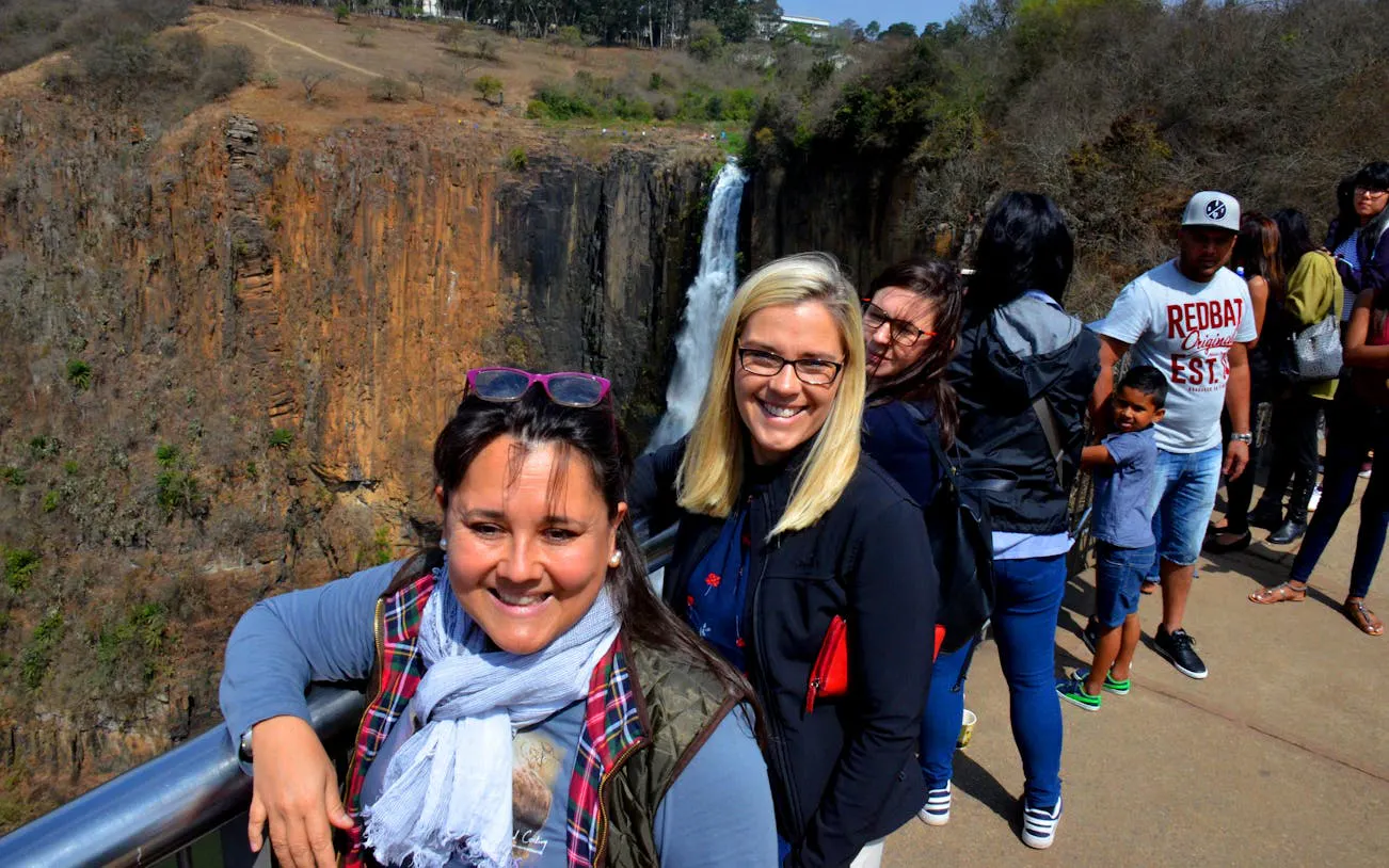 Visitors at Howick Falls during the Full-Day Mandela Capture Site and PheZulu Cultural Tour.