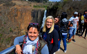 Visitors at Howick Falls during the Full-Day Mandela Capture Site and PheZulu Cultural Tour.