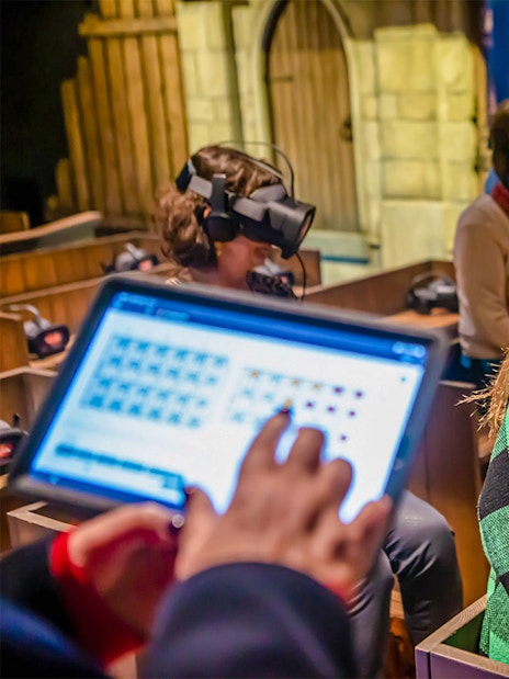 Visitors using VR headsets at Historium Bruges experience.