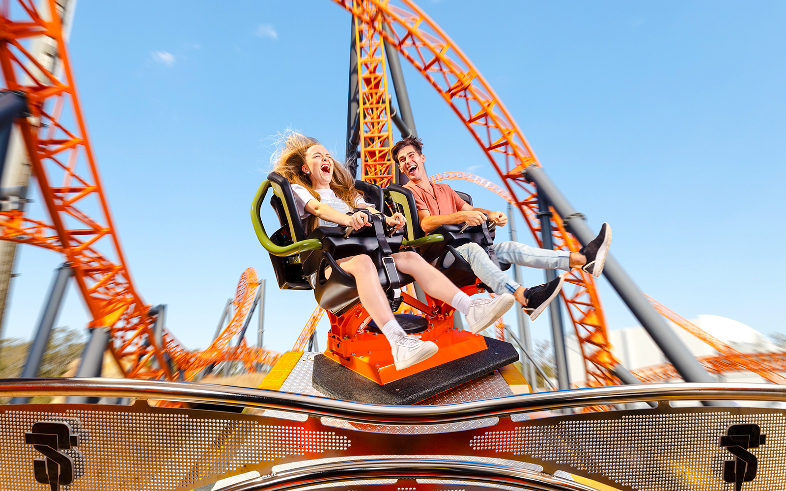 Riders enjoying the Steel Taipan thrill ride at Dreamworld, Gold Coast.
