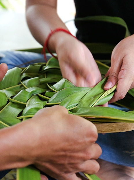 Coconut leaf basket weaving at a workshop.