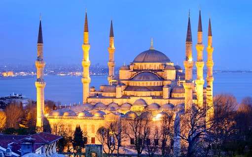 Blue Mosque in Istanbul at dusk, highlighting minarets and domes, related to kebab and dervish experiences.