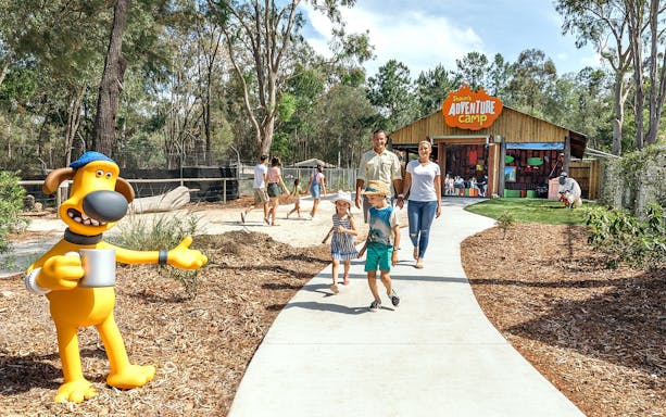 Family walking towards Shaun's Adventure Camp entrance at Paradise Country.