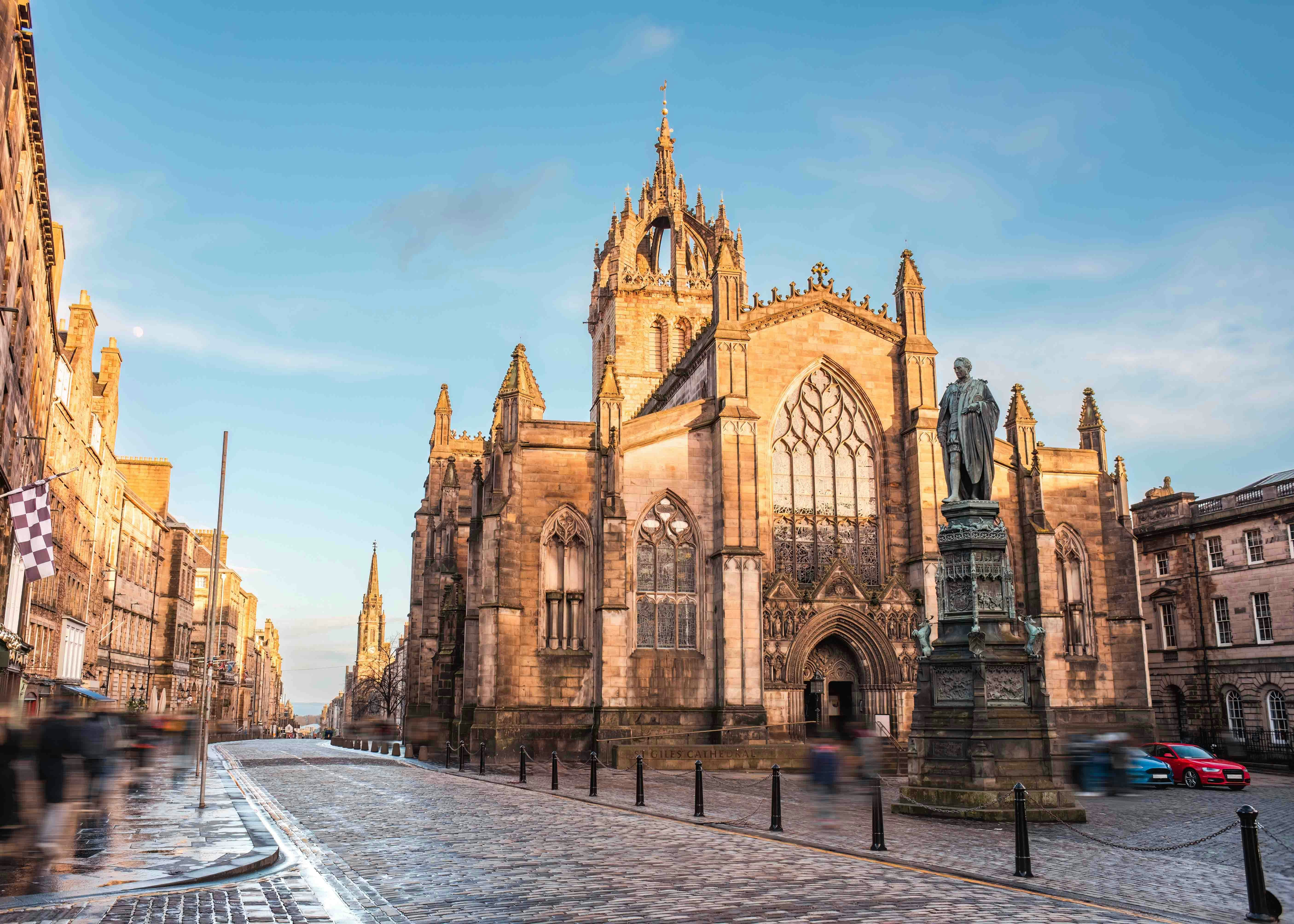St. Giles’ Cathedral on Edinburgh's Royal Mile with statue in foreground.