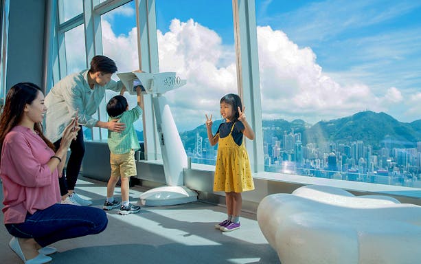 Family enjoying the view from Sky100 Hong Kong Observation Deck.