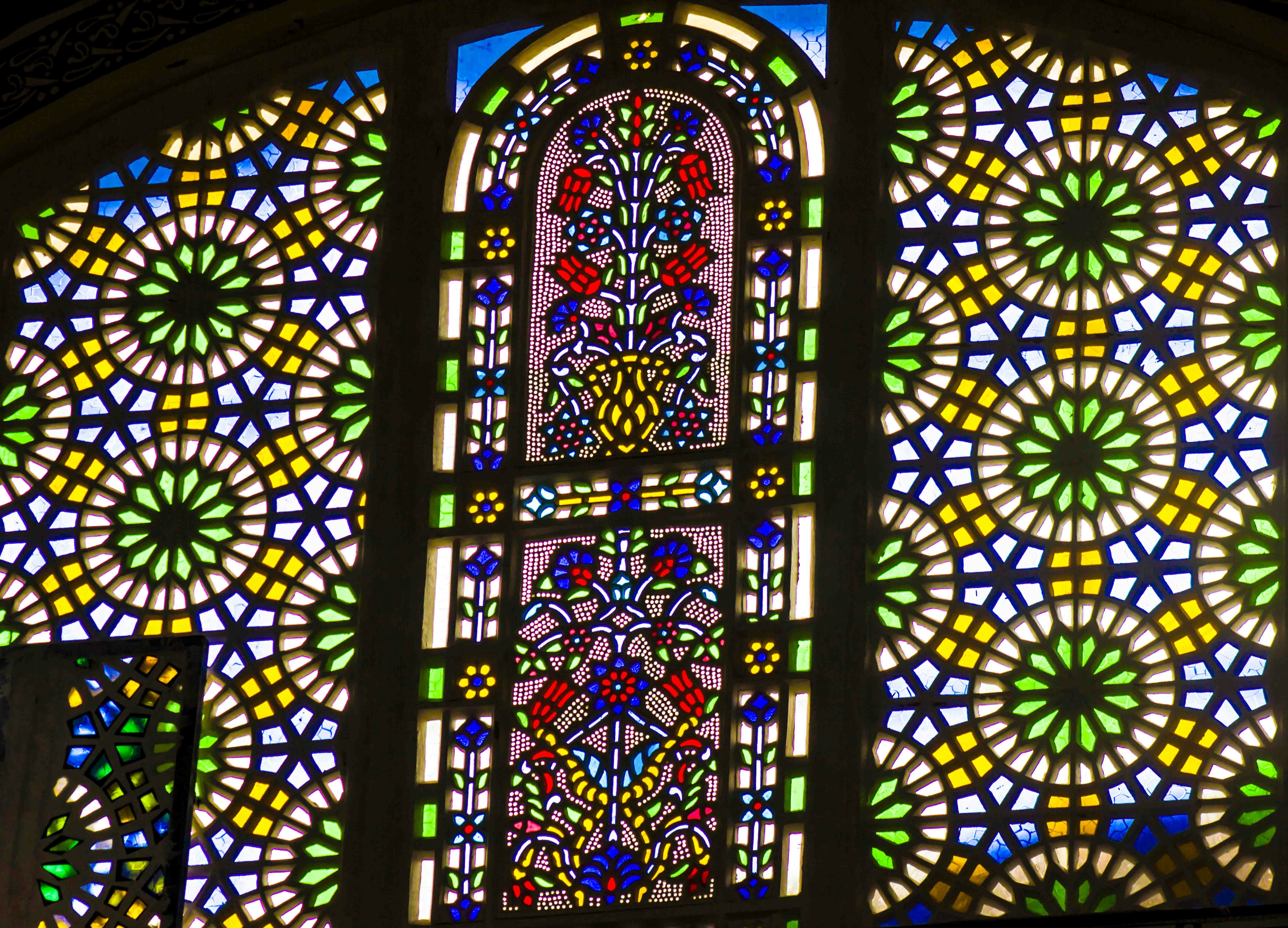 Blue Mosque stained glass windows in Istanbul showcasing intricate geometric patterns.