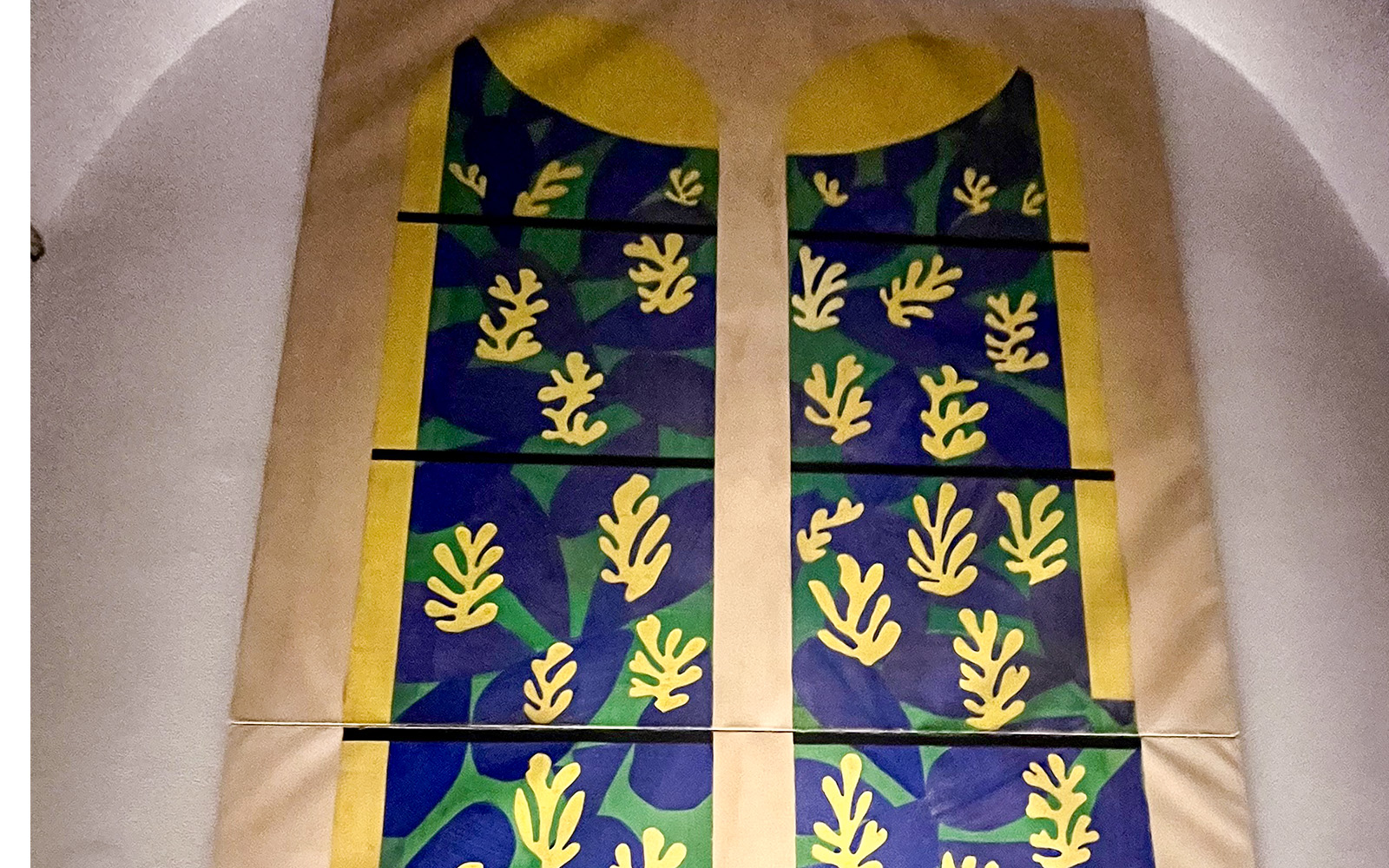 Vatican Grottoes with visitors exploring historic tombs beneath St. Peter's Basilica, Vatican City.