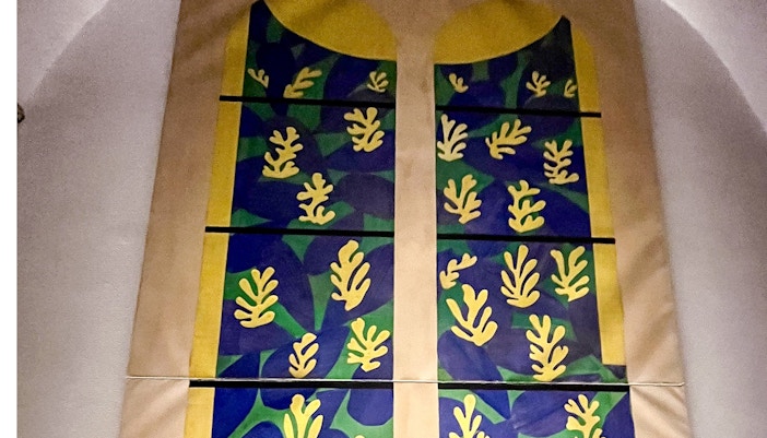 Vatican Grottoes with visitors exploring historic tombs beneath St. Peter's Basilica, Vatican City.