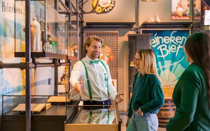 Guests interacting with a guide at the Heineken Experience in Amsterdam.