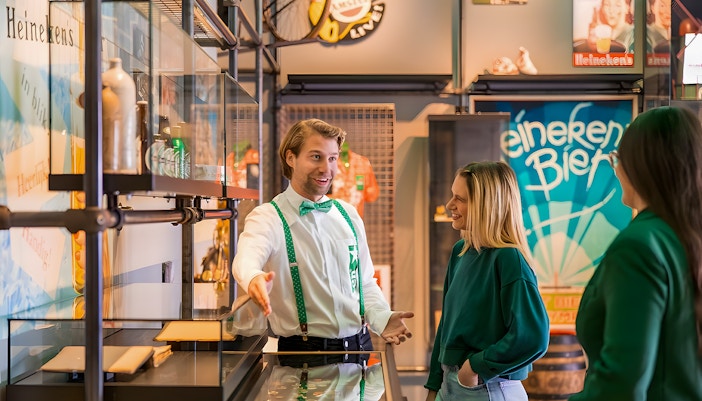 Guests exploring interactive exhibits at the Heineken Experience in Amsterdam.