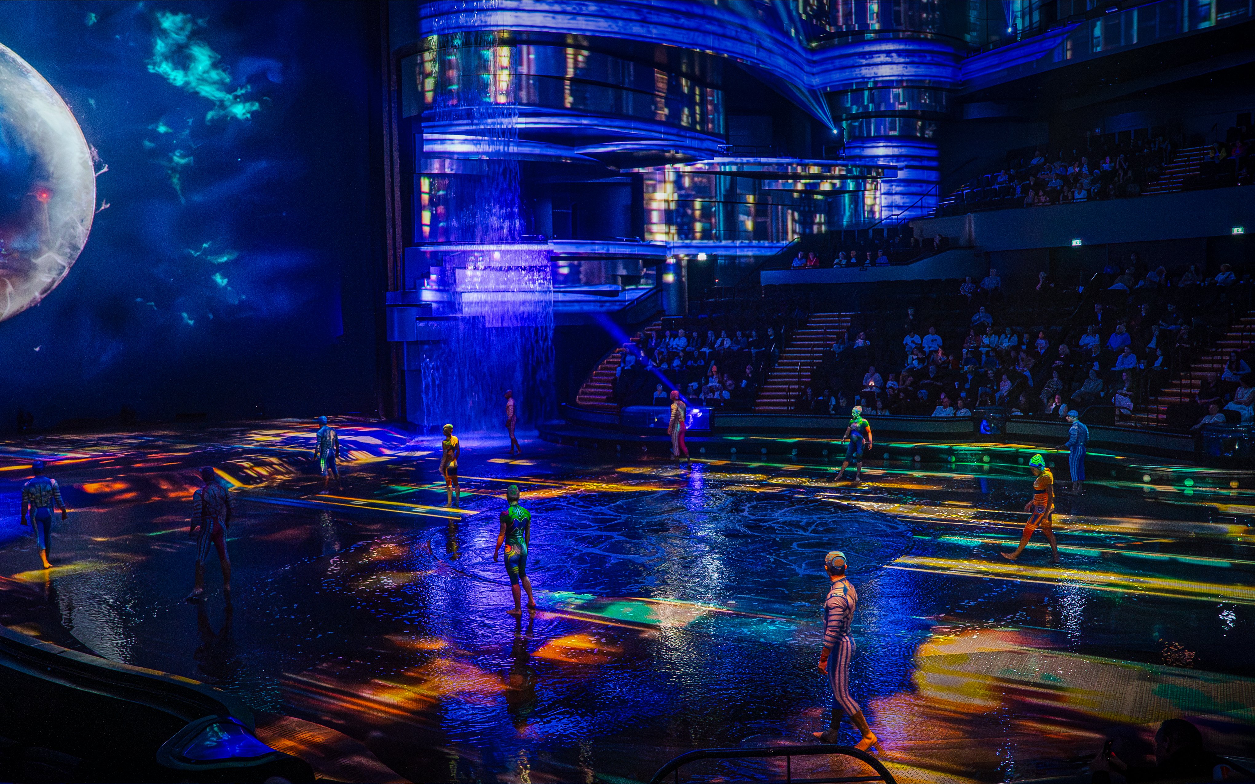 Performers on illuminated stage at La Perle show in Dubai.