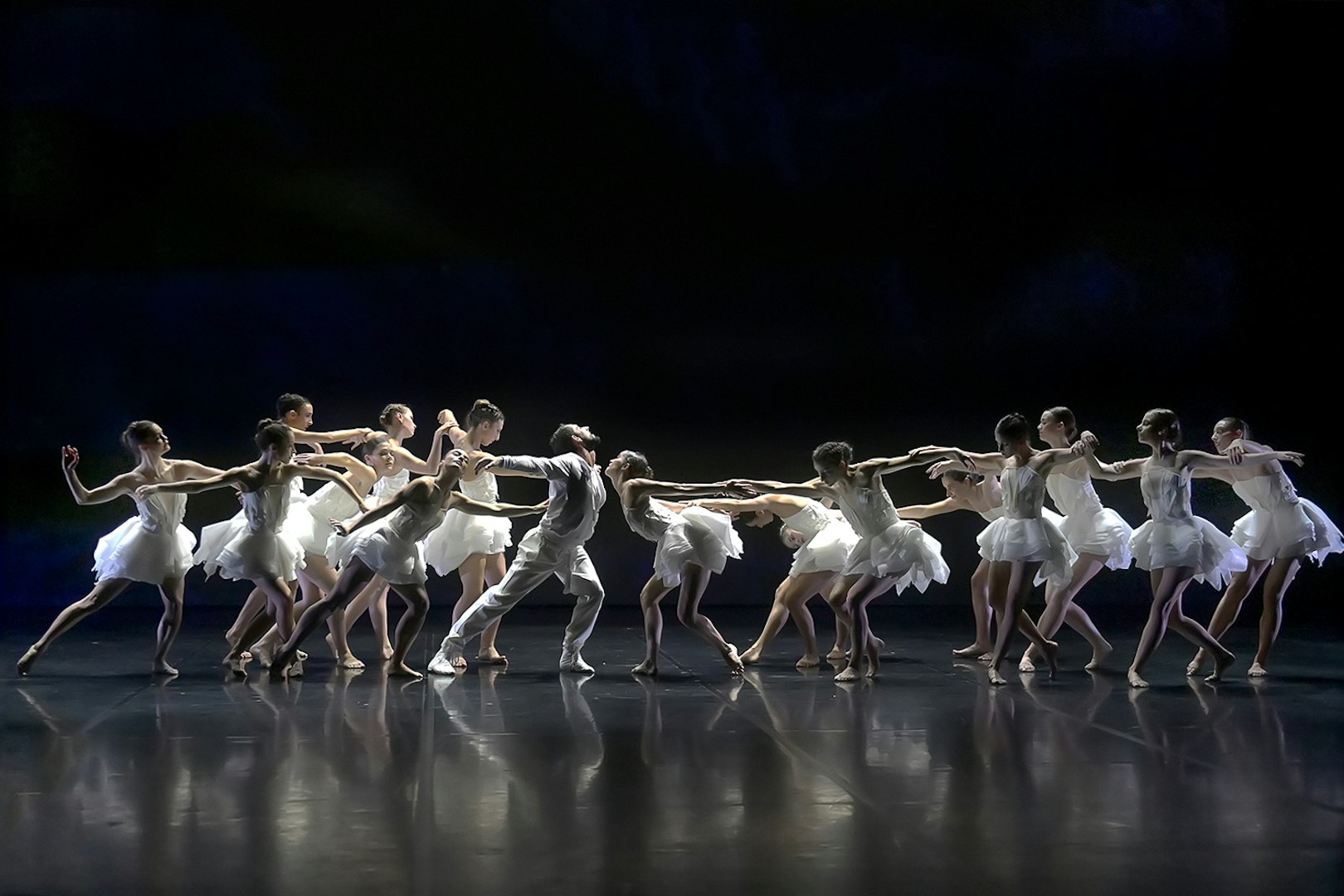 Dancers performing Ballet Preljocaj's Swan Lake on stage.