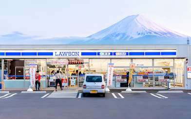 Lawson store with Mt Fuji backdrop, offering ice cream and hot drinks.
