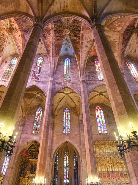 Cathedral of Majorca interior with stained glass windows and vaulted ceilings.