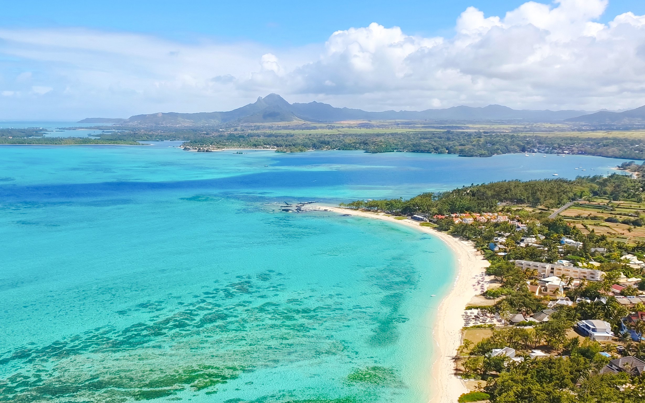 Aerial view of turquoise waters and coastline on the Short Amber Route Seaplane Tour, Mauritius.