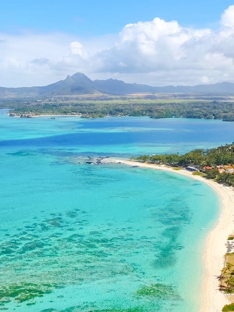 Aerial view of turquoise waters and coastline on the Short Amber Route Seaplane Tour, Mauritius.