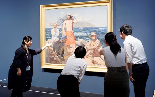 Visitors viewing a painting at The National Museum of Modern Art, Tokyo.