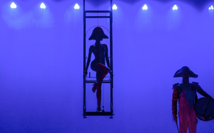 Performer in silhouette at Paradis Latin festive show, Paris.