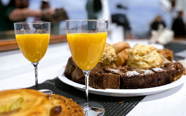 Mimosas and assorted baked cakes on the Liberty Star Boston.