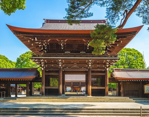 Meiji Jingu Shrine entrance with traditional wooden architecture, Tokyo.