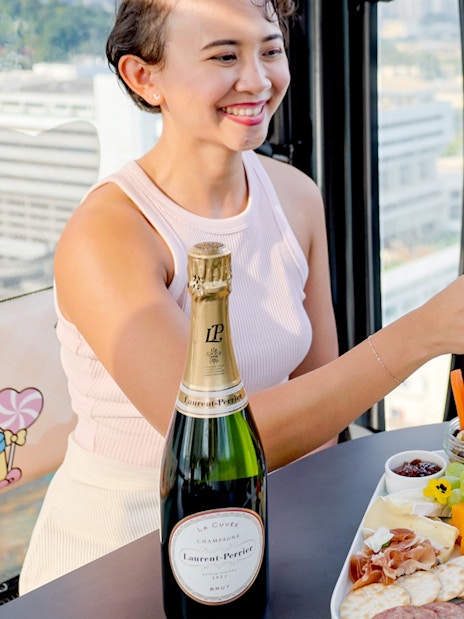 Singapore cable car dining with champagne and gourmet platter.