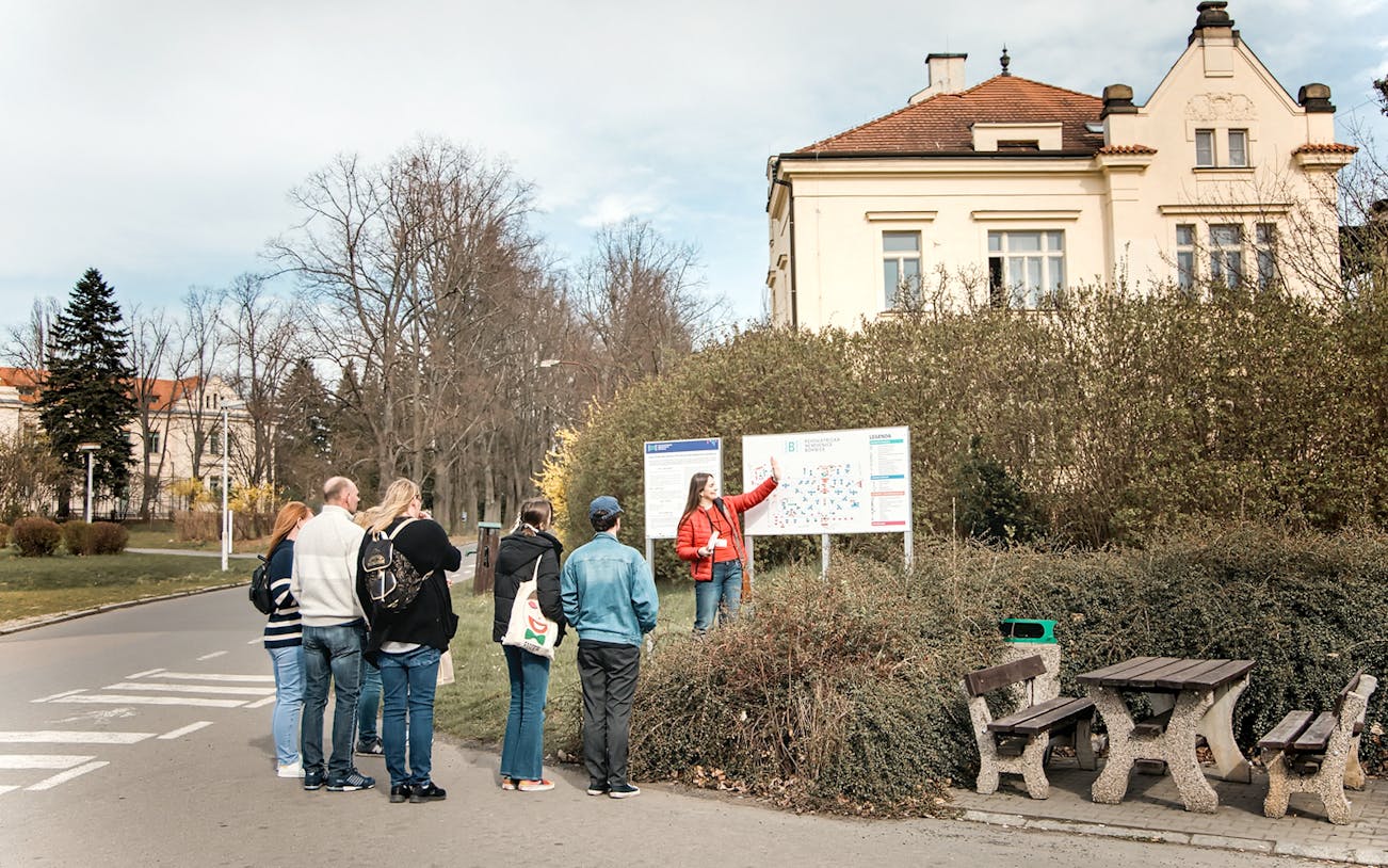 Group listening to a guide at Bohnice Psychiatric Hospital in Prague.