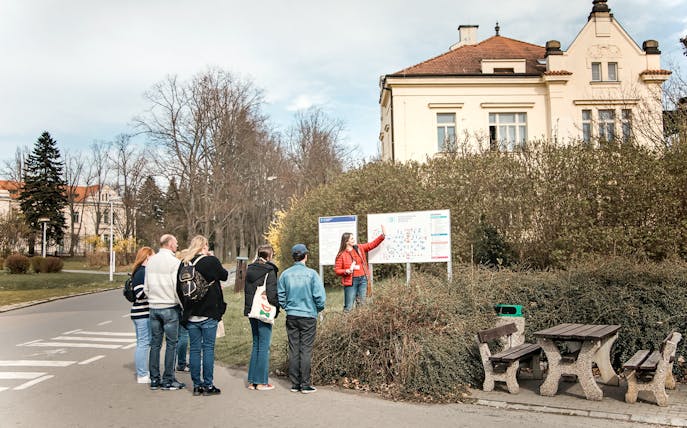 Group listening to a guide at Bohnice Psychiatric Hospital in Prague.