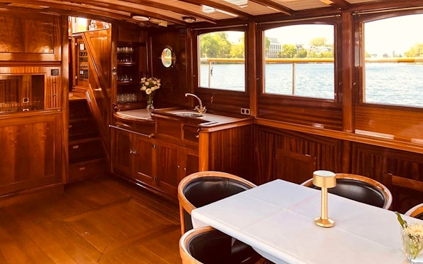Inside view of the Fitzgerald boat's wooden interior during Berlin sightseeing cruise.