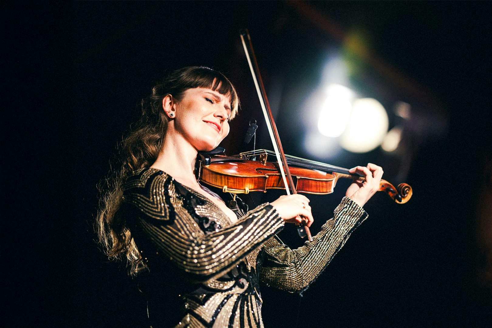 Violinist performing at Strauss concert in Prater, Vienna.