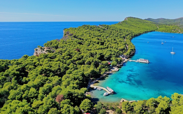 Aerial view of Telašćica Nature Park's coastline and boats in Croatia.