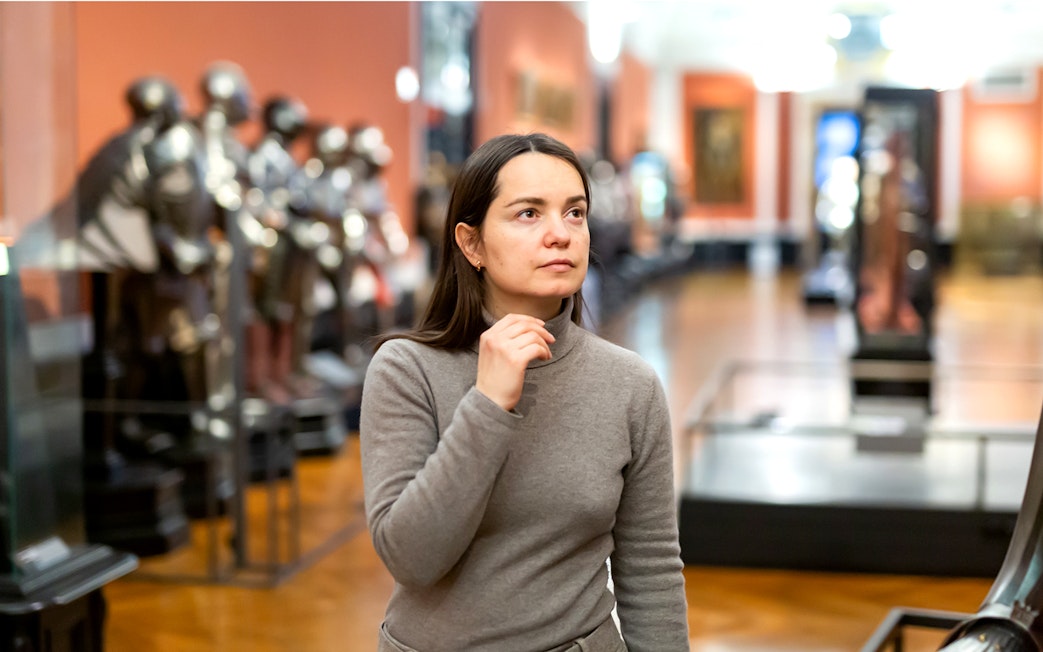 Visitor exploring the Sisi Museum in Vienna's Hofburg Palace.