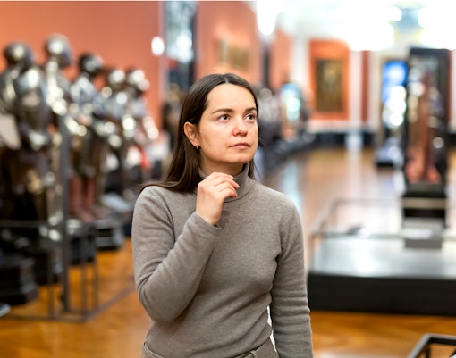 Visitor exploring the Sisi Museum in Vienna's Hofburg Palace.