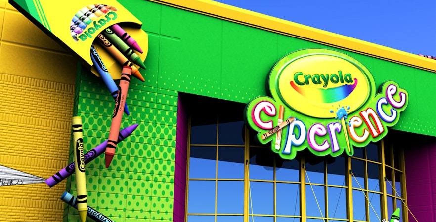 Crayola Experience entrance with giant crayons in Orlando.