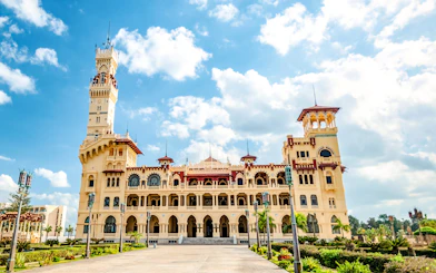 Royal Palace with Turkish and Florentine architecture, 1930s style, under a blue sky.