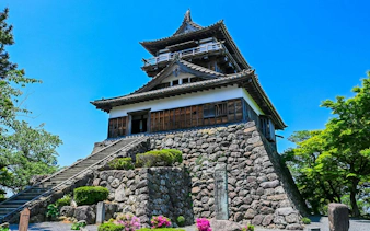Maruoka Castle with stone walls under blue sky, Sakai City, Fukui Prefecture.
