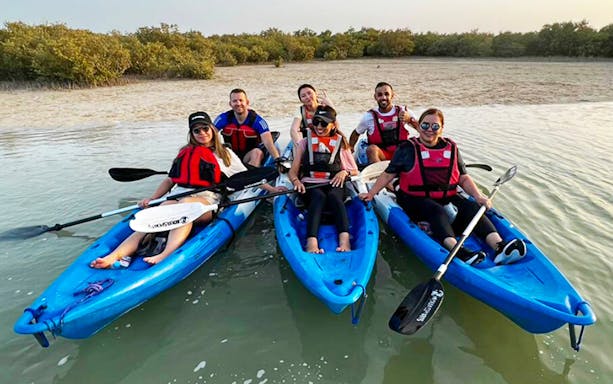 Group kayaking in Dubai's mangroves.