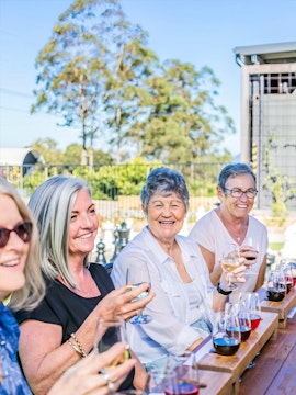 Group enjoying wine tasting in Sunshine Coast Hinterland.