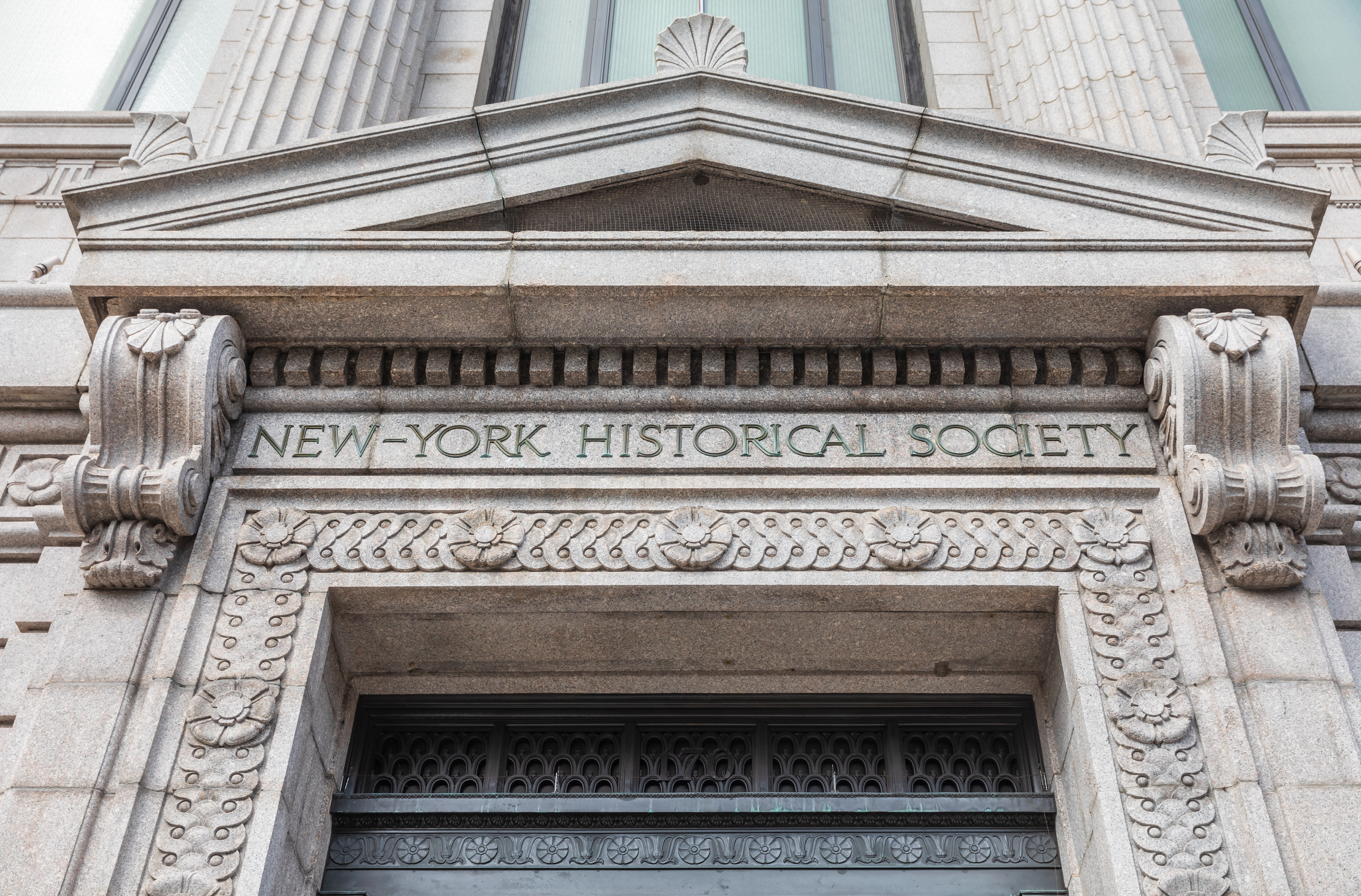 New-York Historical Society building entrance with ornate stone carvings.