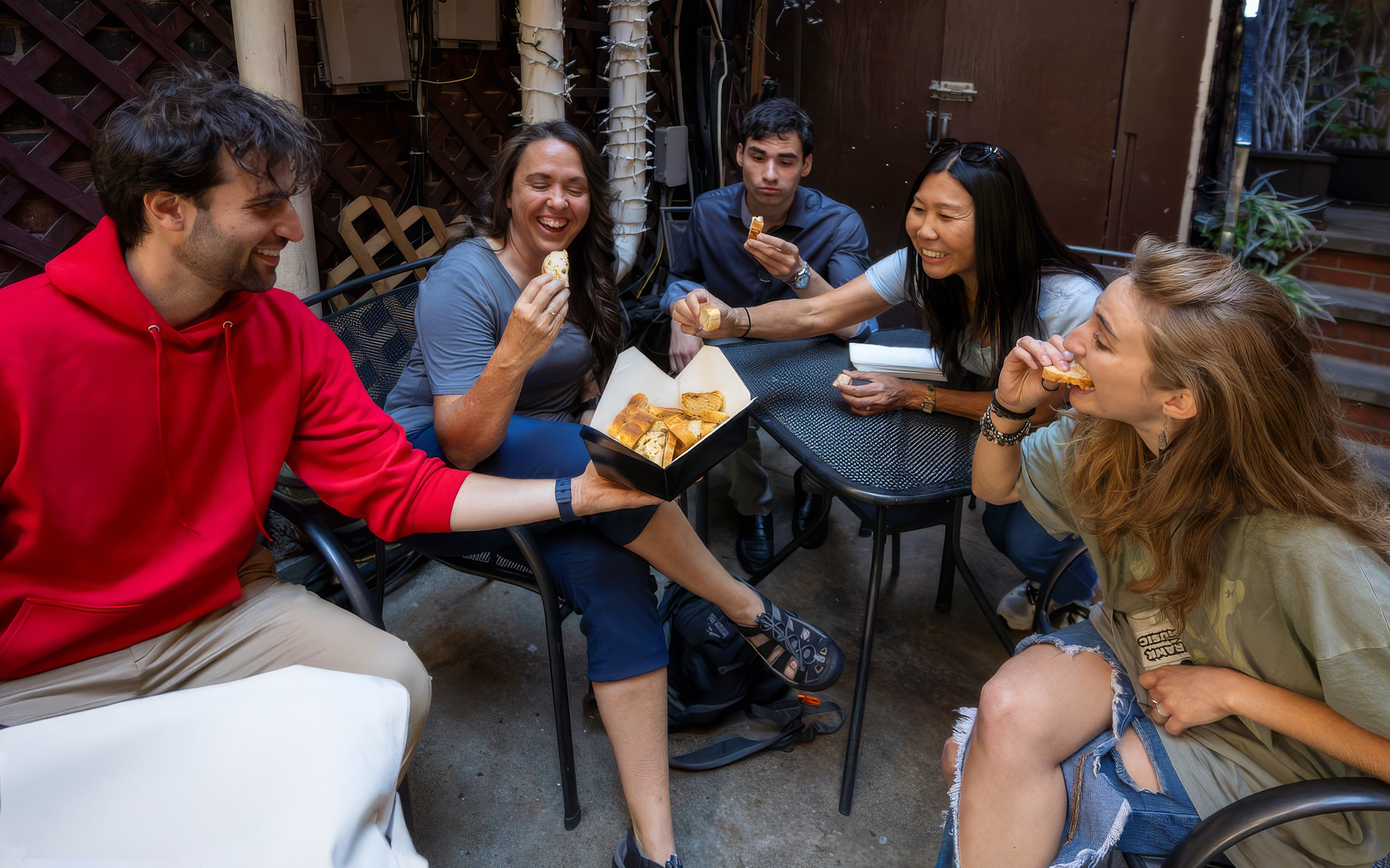 Guests enjoying pizza on a Boston food tour.