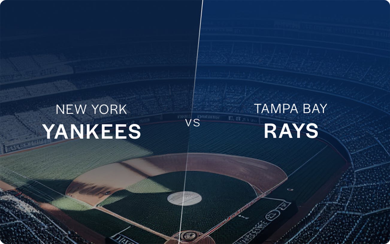 New York Yankees vs Tampa Bay Rays game at a baseball stadium.