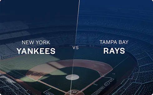 New York Yankees vs Tampa Bay Rays game at a baseball stadium.