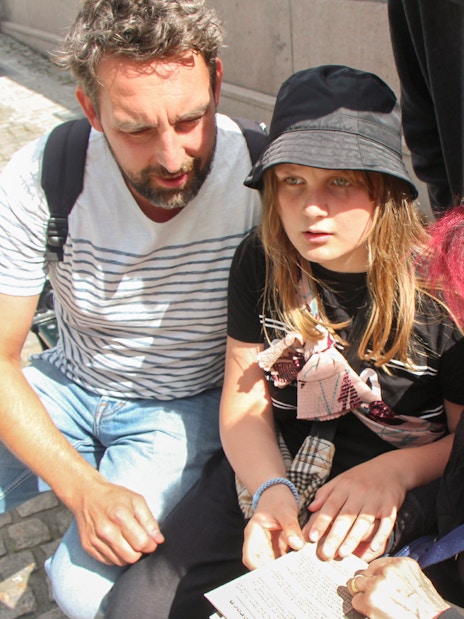 Group solving clues during Nyhavn Mystery Adventure in Copenhagen.
