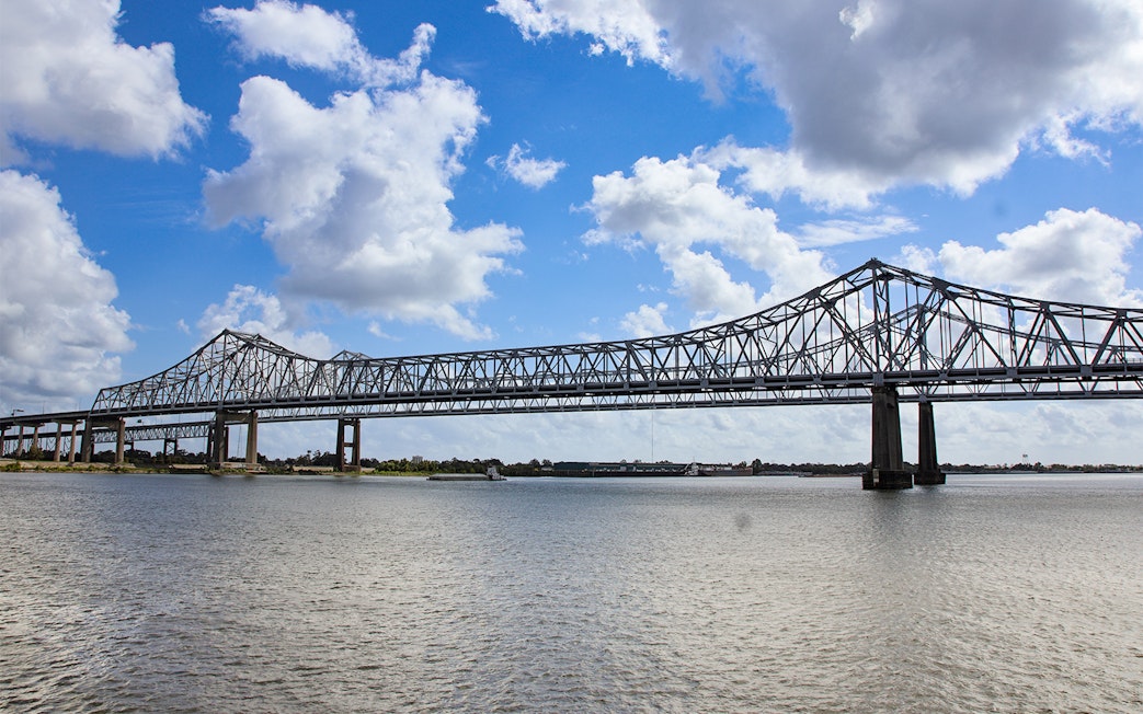 New Orleans bridge spanning Mississippi River viewed from Steamboat Natchez.
